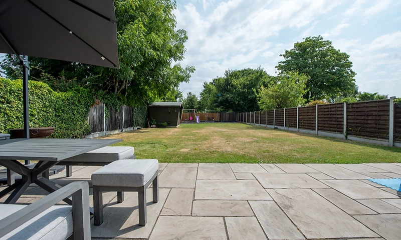 a modern back garden with patio space