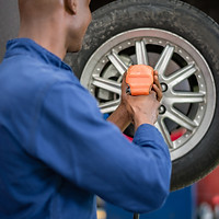 Mechanic fixing a flat tyre