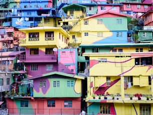 Colorful apartment buildings grouped together on a hill