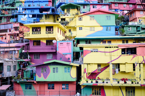 Colorful apartment buildings grouped together on a hill