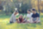 People sitting on a meadow