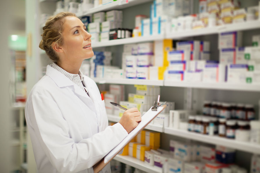 Pharmacist reviewing medication stock
