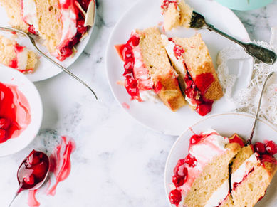 Slices of strawberry shortcake in white dessert plates