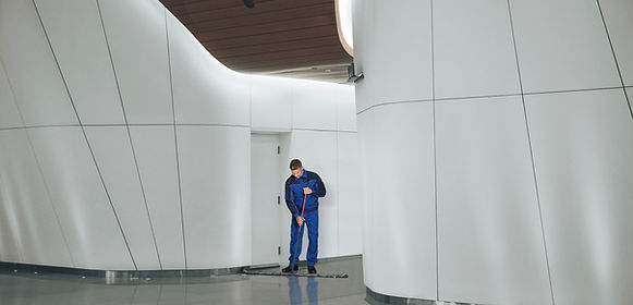 Janitor Cleaning Hallway
