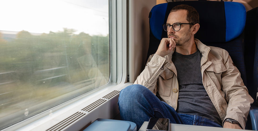 Man looking out of train
