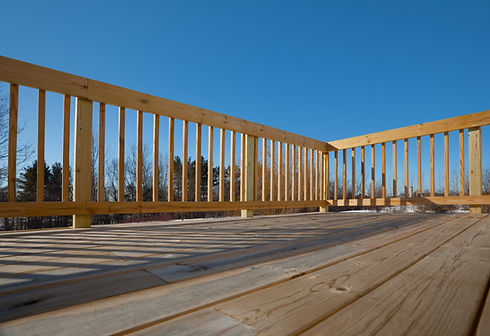New Pine Wood Lumber Patio Deck Surface with Railing, Shadow; The railing meets-up cleanly