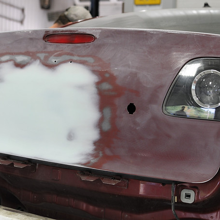 Autobody garage, bondo on car