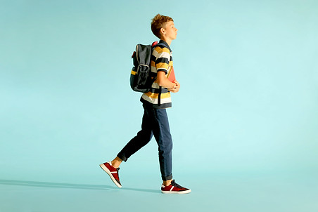 Boy walking to school | The Link 2 Success
