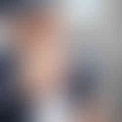 Locksmith inserting key into door lock