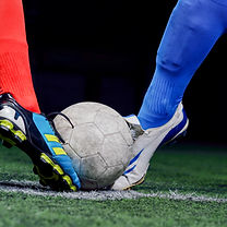 Football and player legs