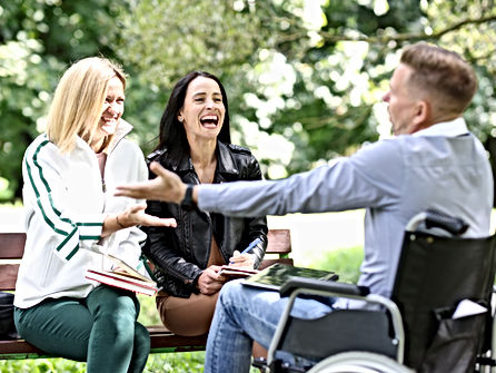 Friends enjoying company in park