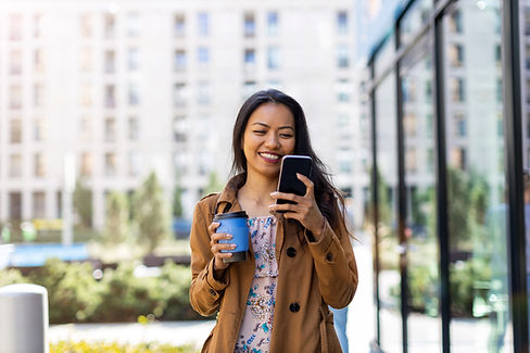 Woman Reading a Message from Phone