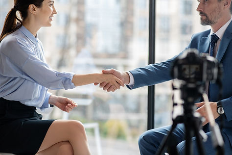 Shaking Hands in Front of a Camera