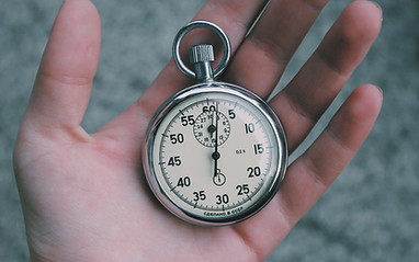 Hand Holding Stopwatch