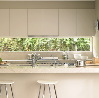 Task lighting through natural light in the large white kitchen. 