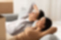 Couple Relaxing On Sofa