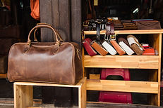 Big leather bag in front of a leather shop