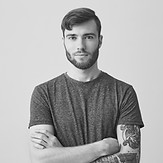 Young Man with Arm Tattoo