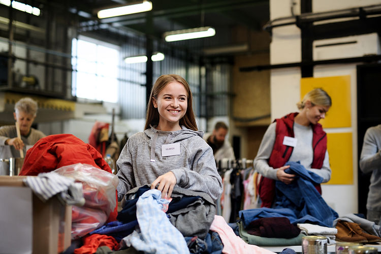 Sorting clothes for charity event