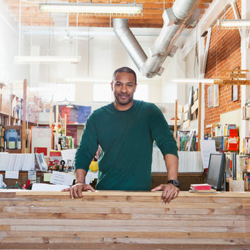 A mystical night sky filled with glowing gold zodiac symbols and constellations over a calm mountain range.