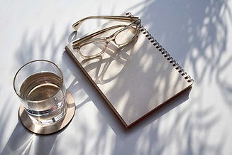 Glasses on Spiral Notebook