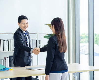 A man and a woman shaking hands