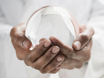Glass ball in hands