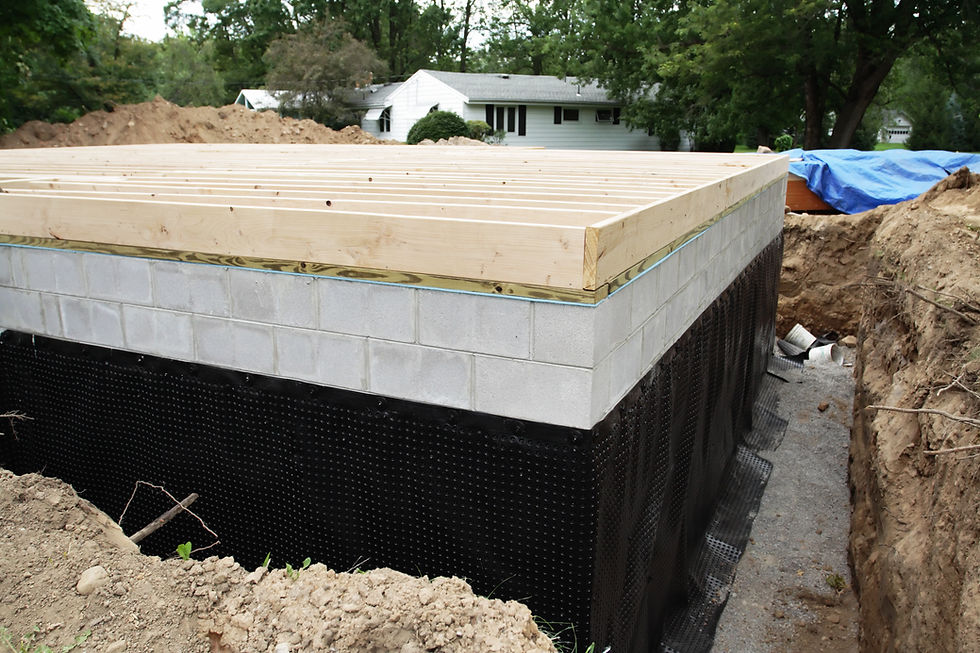 A suburban residential construction home addition has a new basement foundation