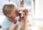 Woman hugging dog at the veterinarian