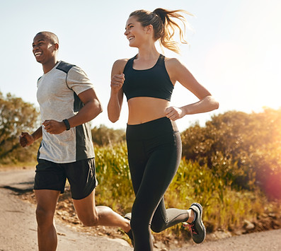 Two People Jogging Outdoors