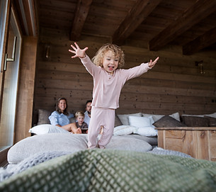 Girl Jumping On Bed
