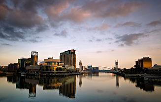 Lowry Theatre and bridge reflections at sunset. Salford Quays, Manchester, UK