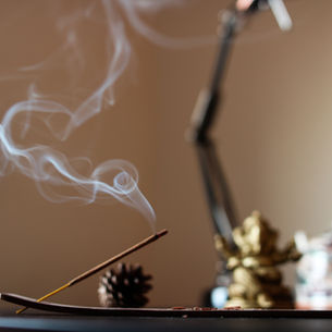 Aura cleansing tools including palo santo, sage, and clear quartz crystals