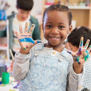 Student with messy hands in classroom