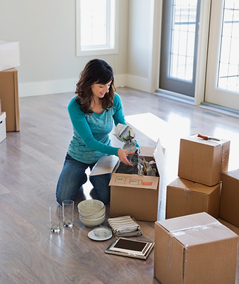 Woman unpacking in her new home