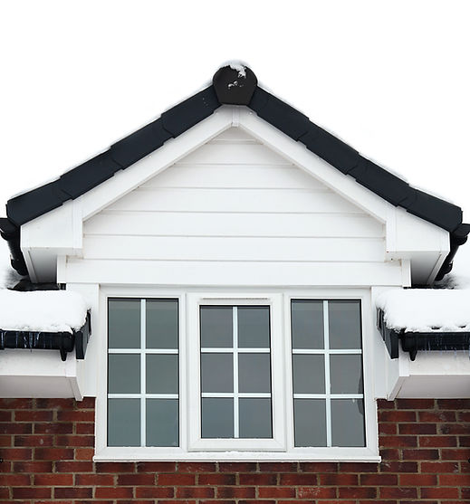 White uPVC cladding around a window on a red brick house wall