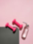 Pink dumbbells and water