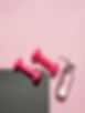 Pink dumbbells and water