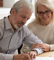 Couple Signing Document