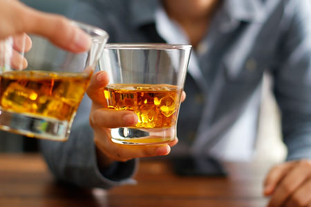 Clinking Whiskey Glasses