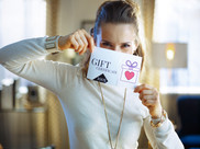 Person holding a GIFT CARD
