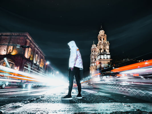 A person in a city wondering why I feel so lonely even though I have friends