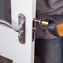 handyman repair the door lock in the room