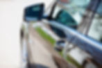 side view of a car with focus on the car door's handle