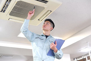 Engineer Examining Air Conditioner
