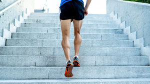 man running up stairs