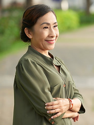 Smiling Asian woman posing outdoor