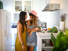 Couple standing in the kitchen together