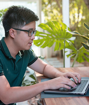 A man working on a laptop PC