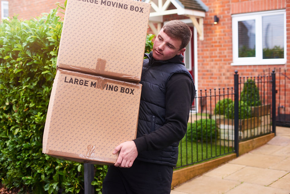 Removal company helping a family move out of their old home